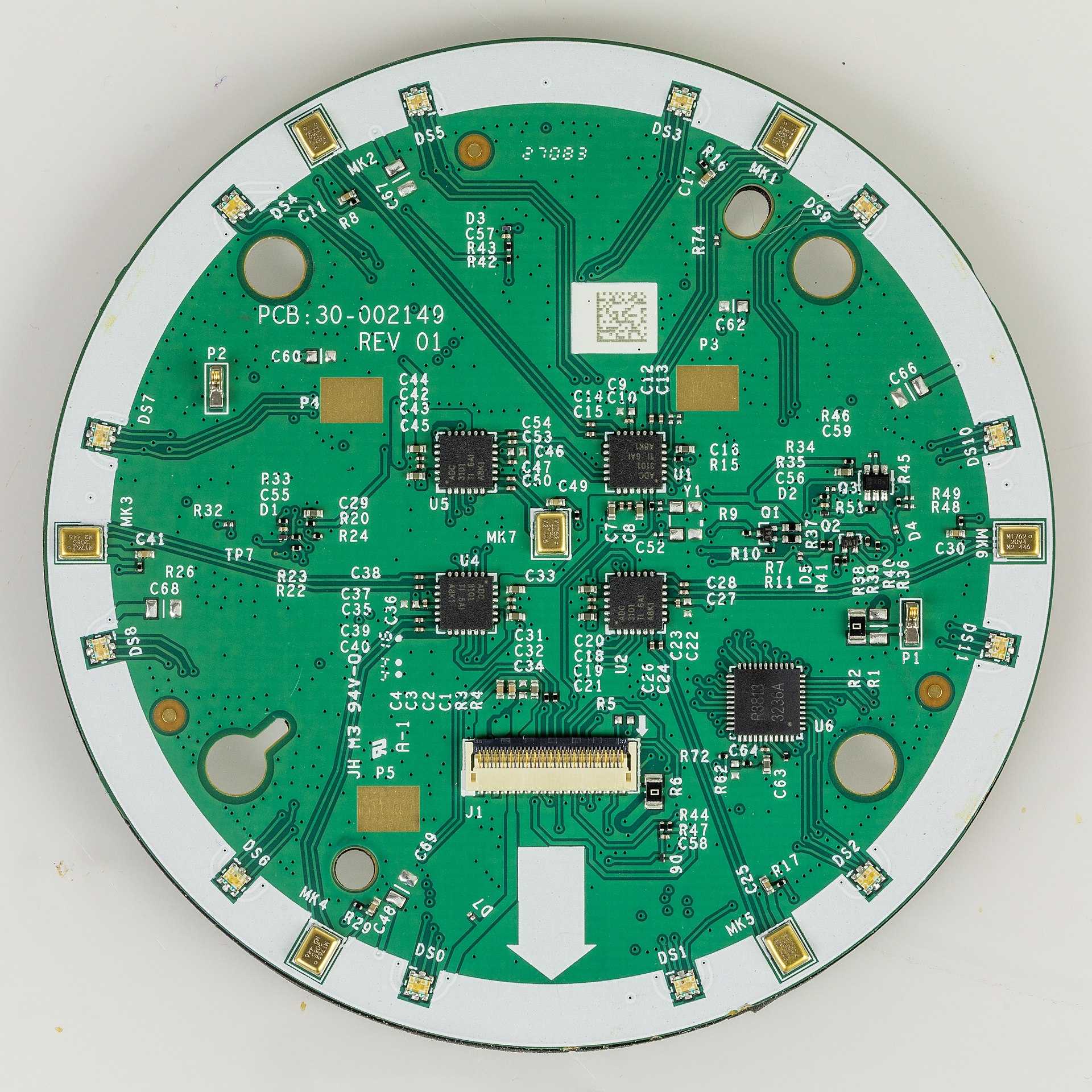 A circular circuit board from inside an Amazon Echo smart speaker device.