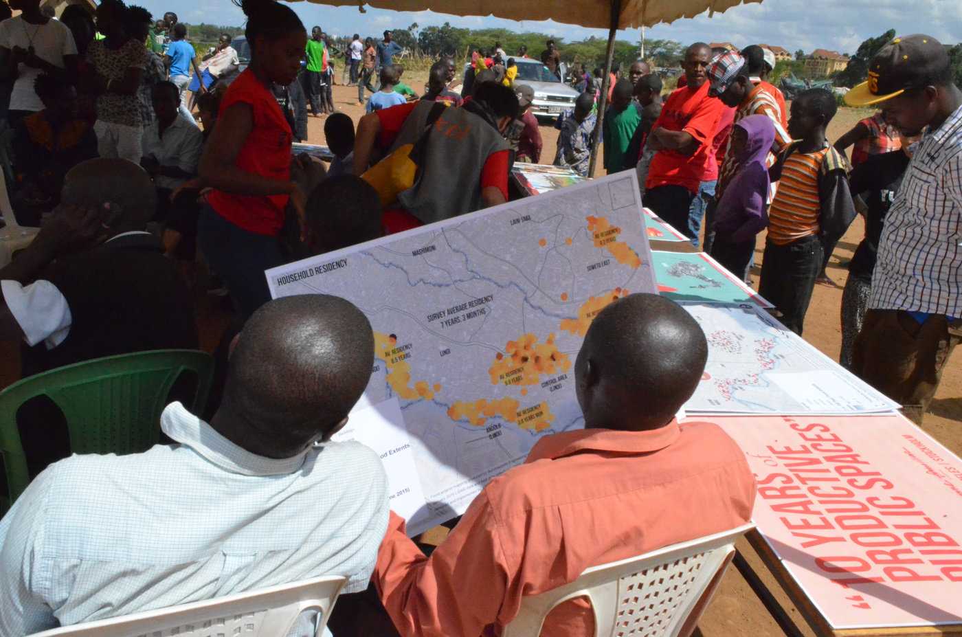 Stakeholders review crowdsourced flood maps in Kibera, an informal settlement in Kenya's capital. 