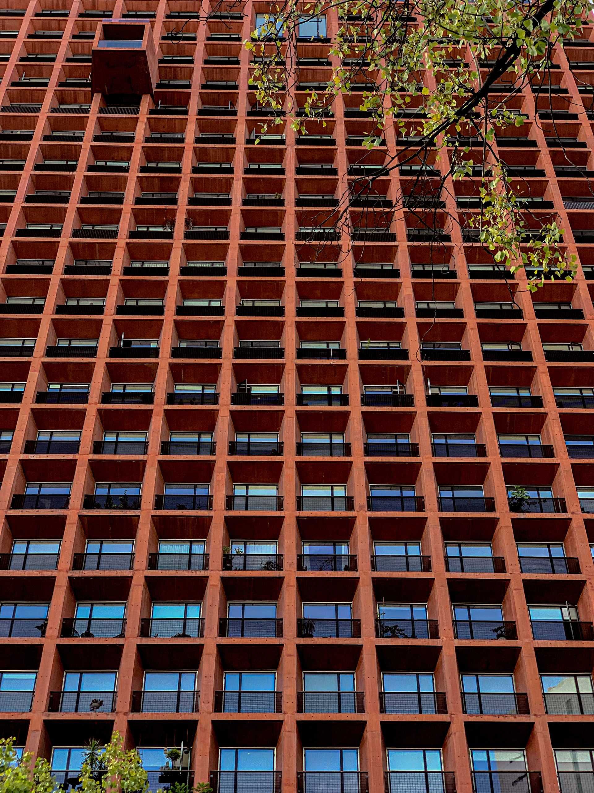 The facade of a brown modernist building.