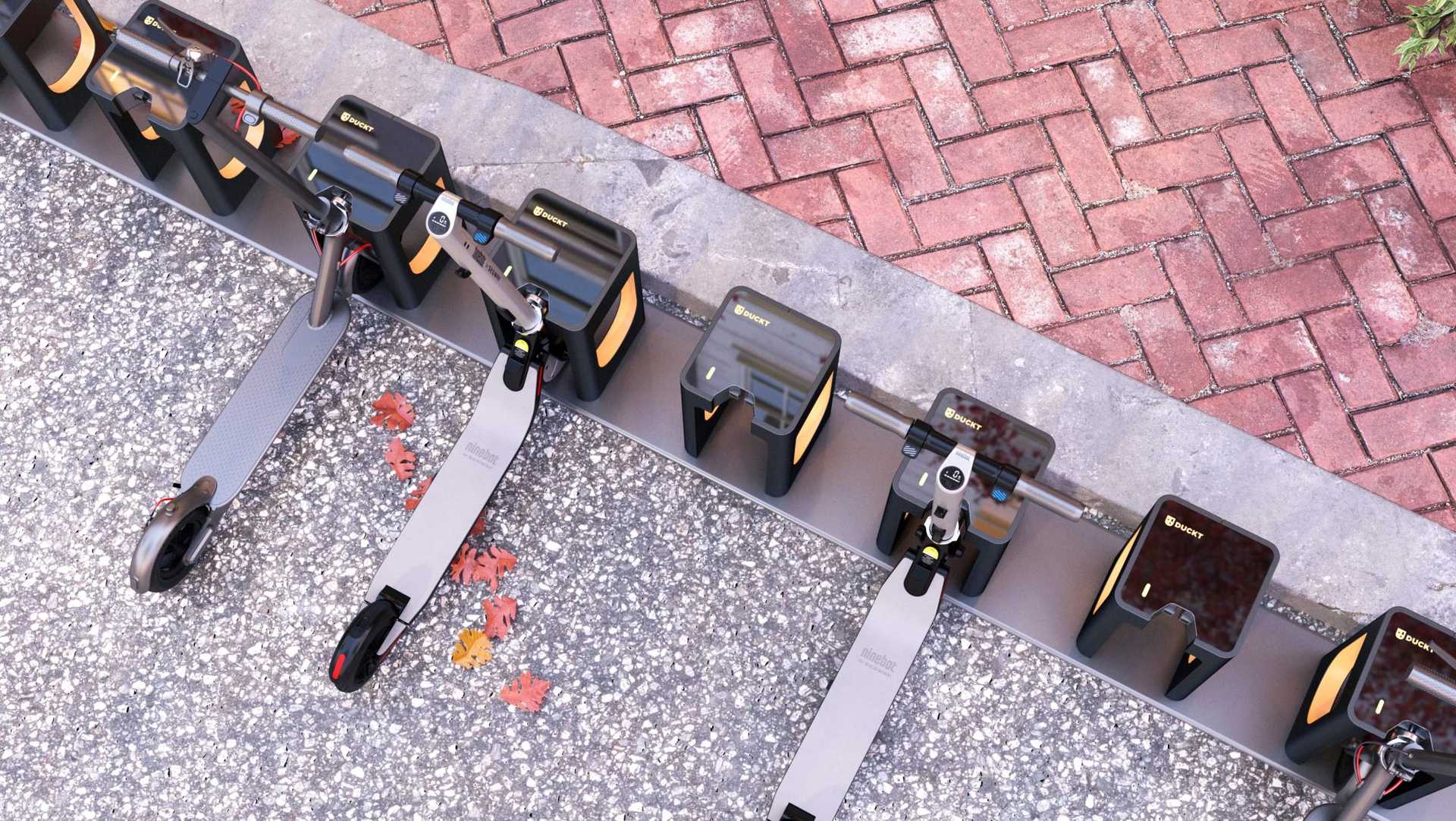 Overhead view of scooters parked at a docking station.