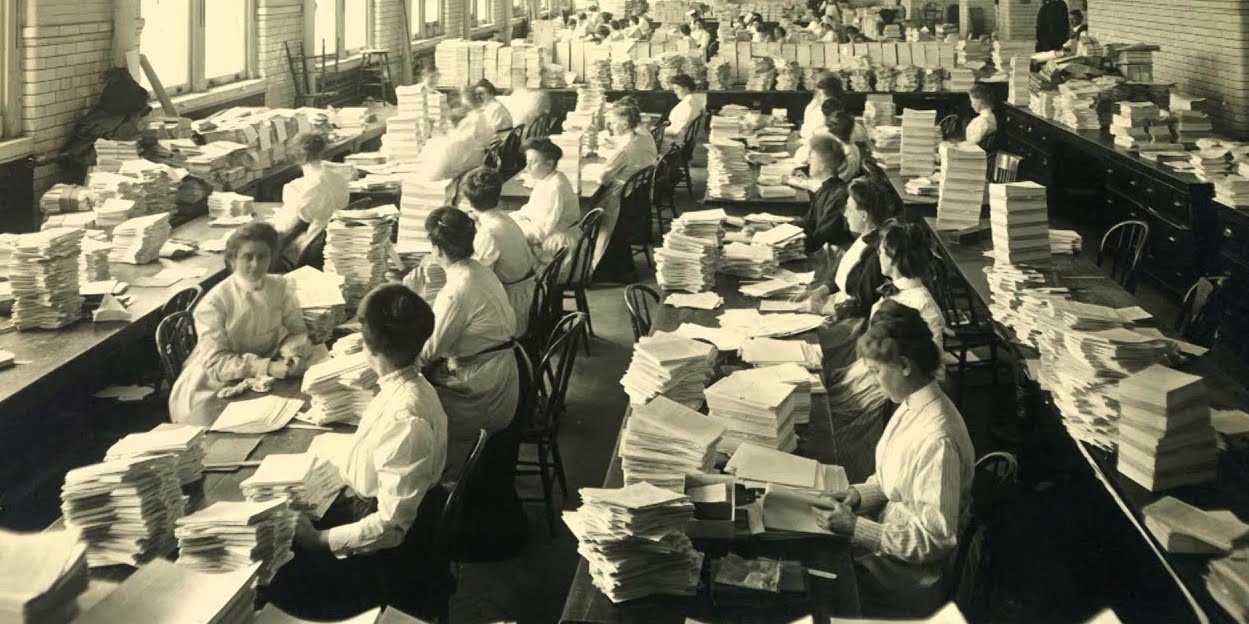 Female civil servants compile pages of publications at the US Government Printing Office, 1905.