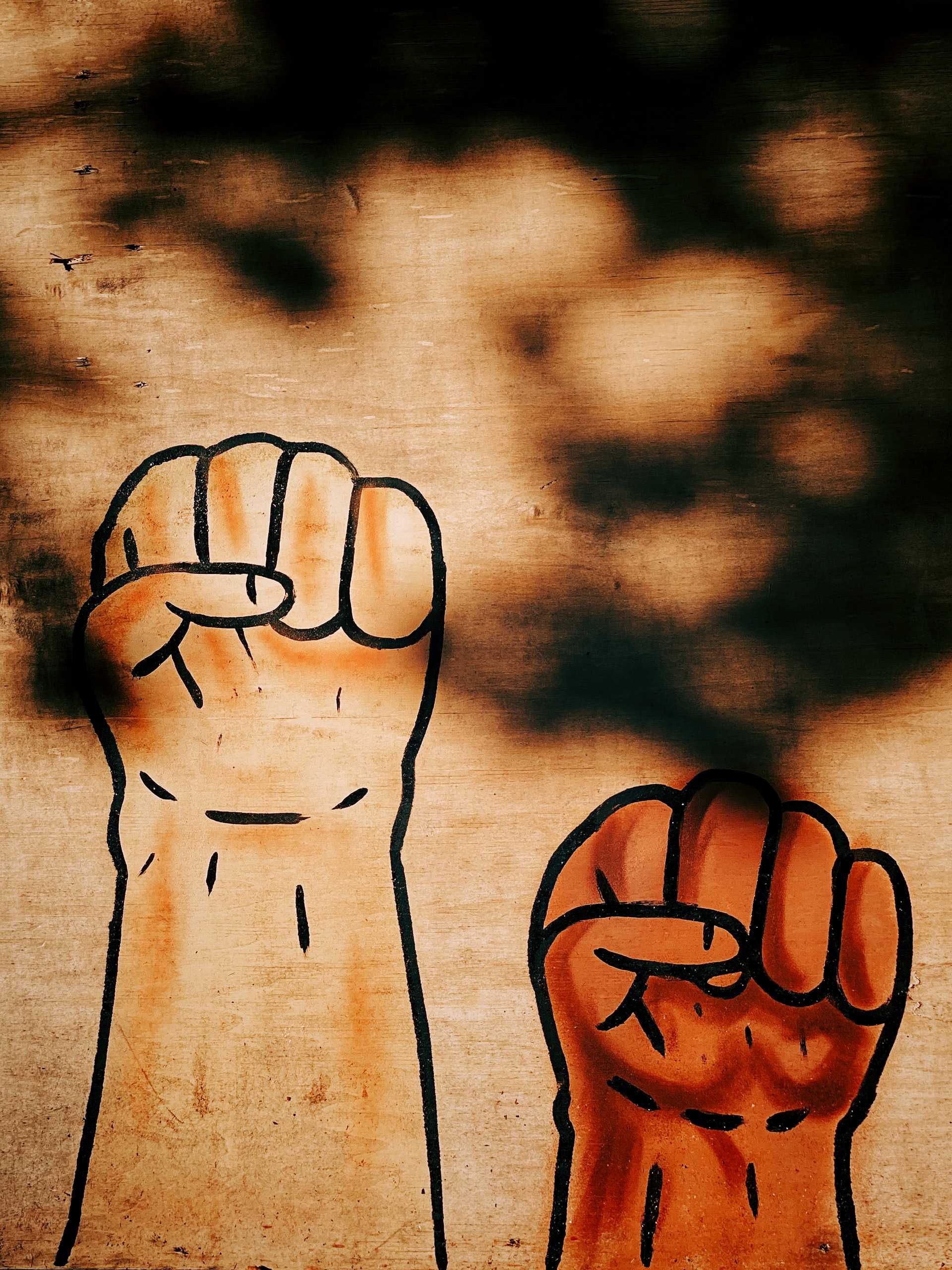 A drawing of raised fists.