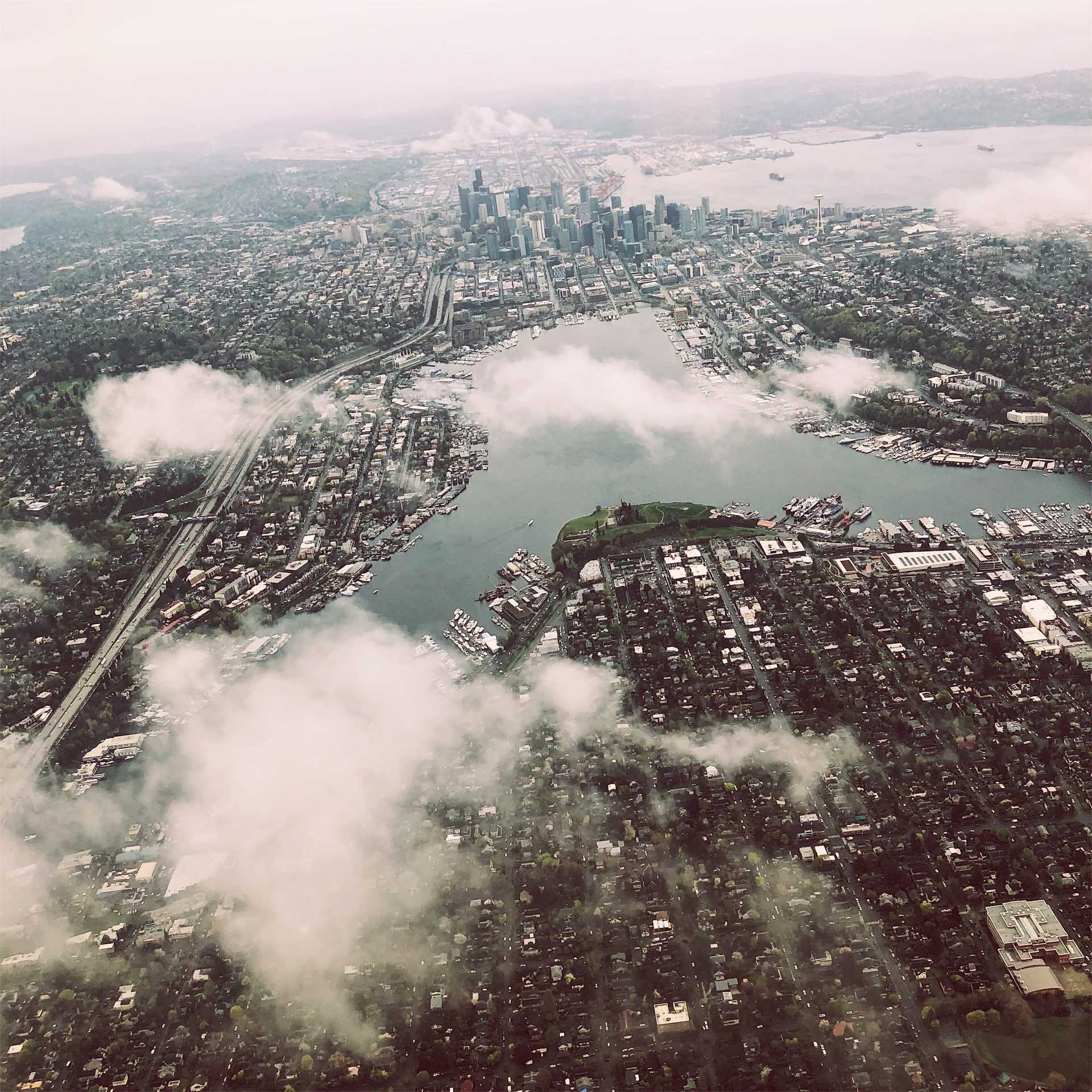 A aerial view of Seattle through the clouds.