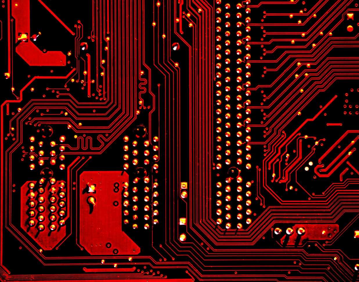 Closeup of a red and black circuit board.