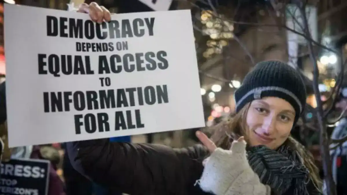 A student protests net neutrality laws.