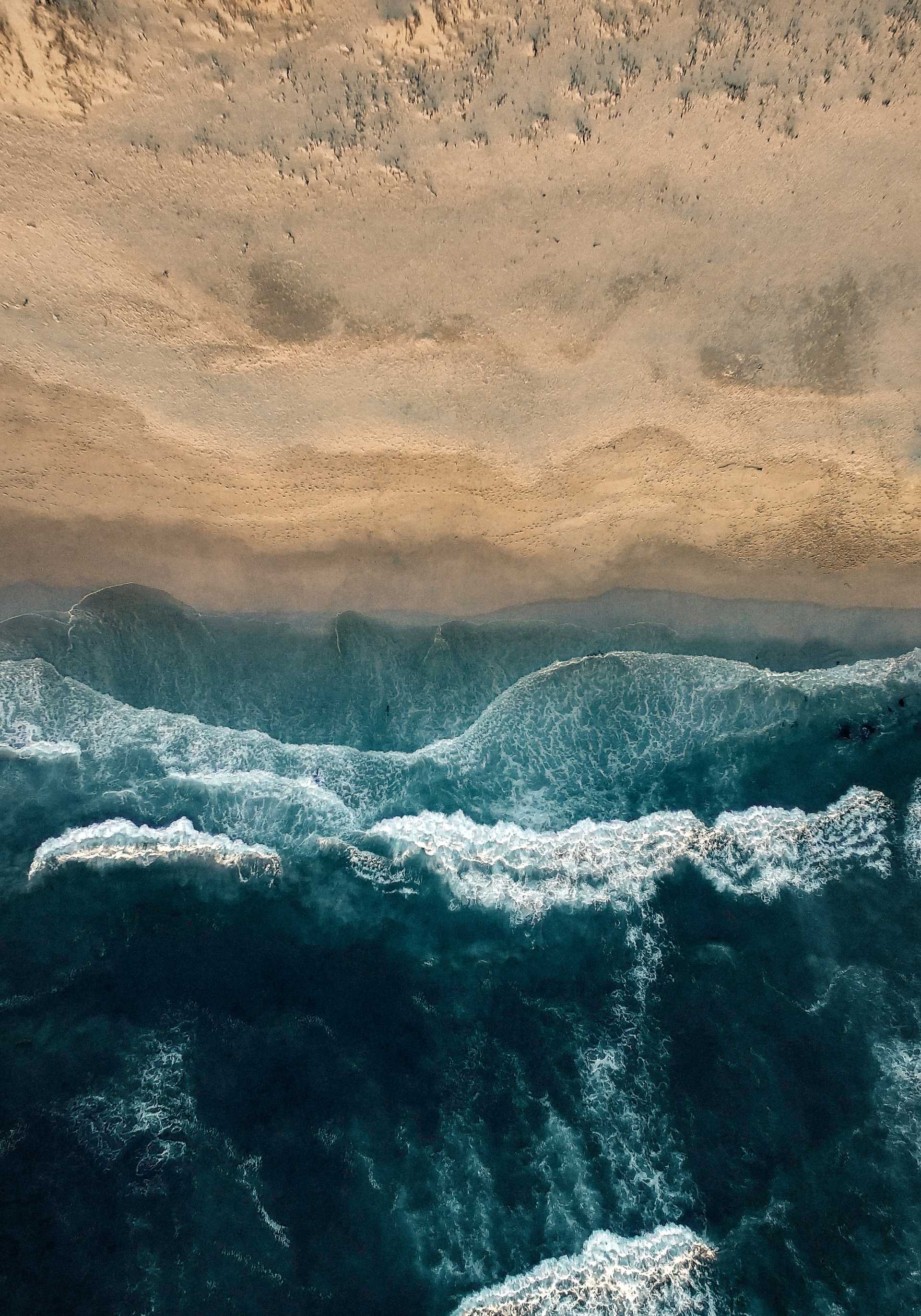 Overhead shot of waves on a beach in Cape Town, South Africa