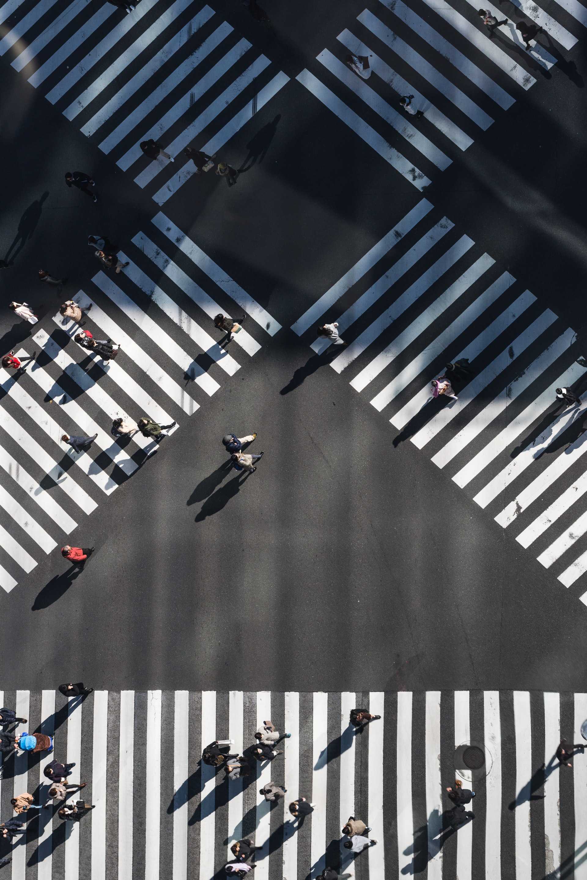 Overhead view of intersection with diagonal, cross-crossing crosswalks.